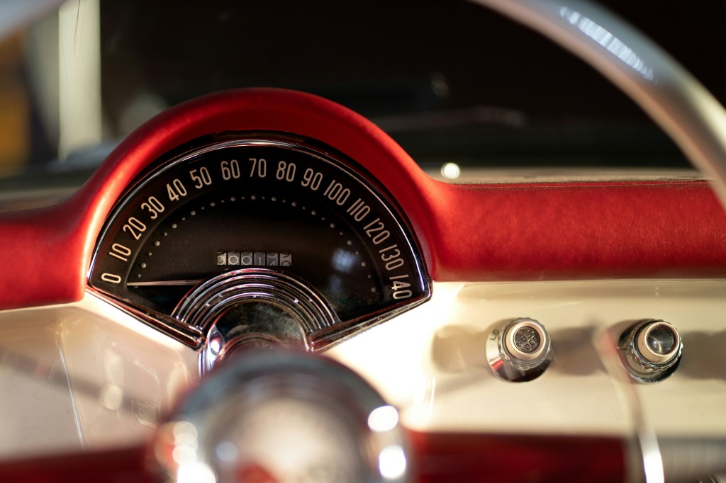 a close-up of a classic car speedometer, reading 0 MPH